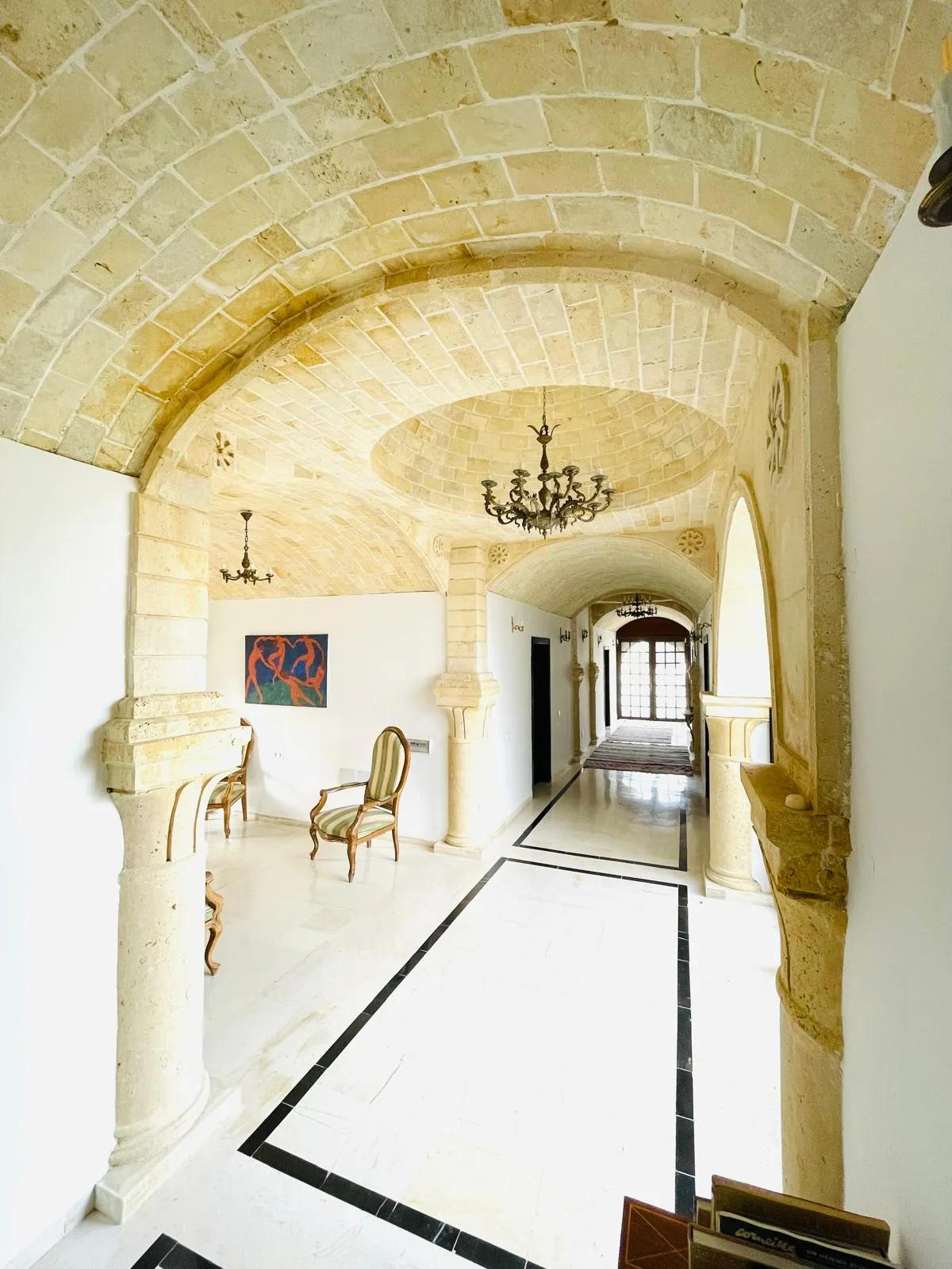 Stone archway and vaulted corridor inside the Trinity Soul retreat property
