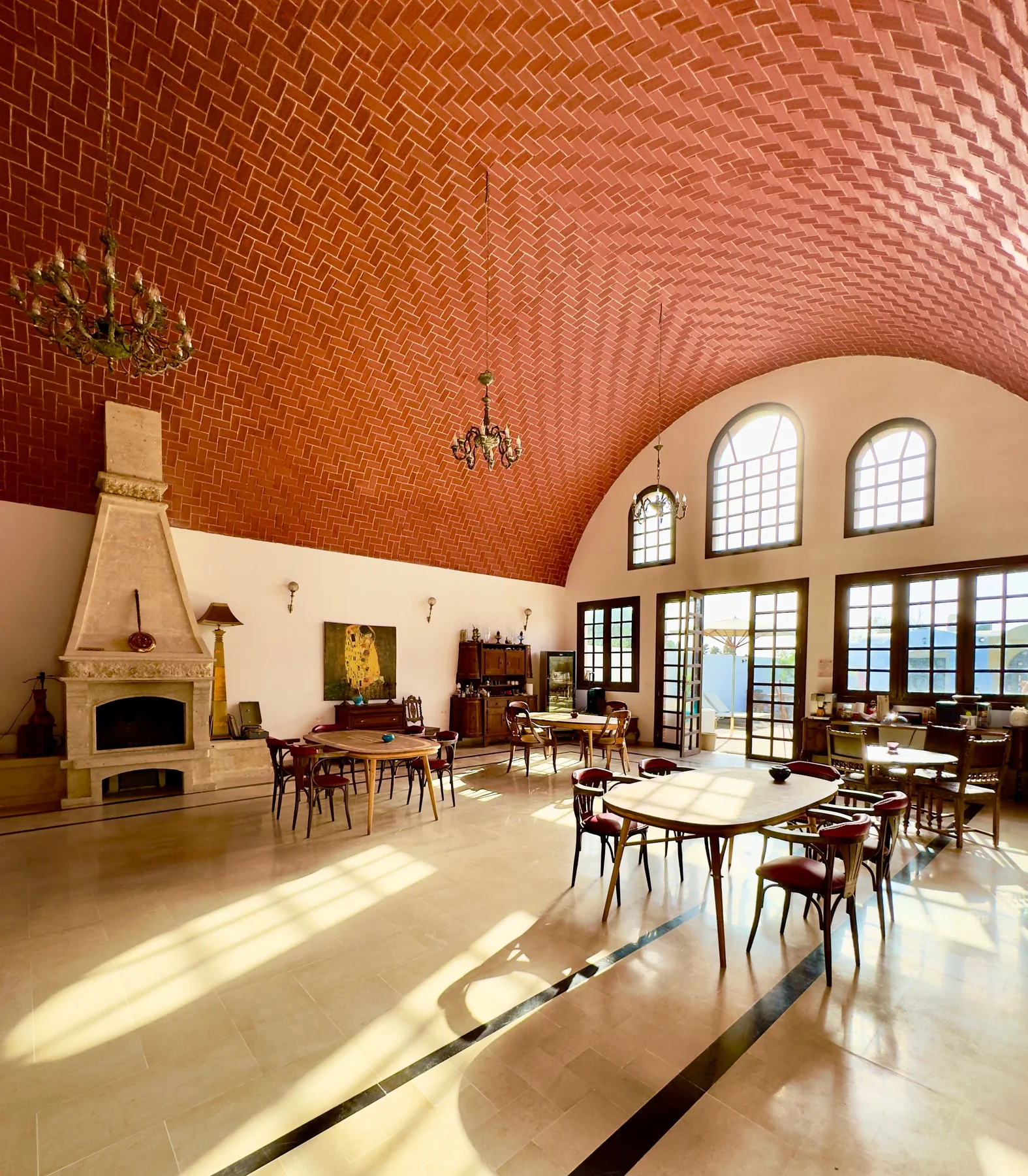 Communal dining room with a vaulted brick ceiling at the Trinity Soul retreat property
