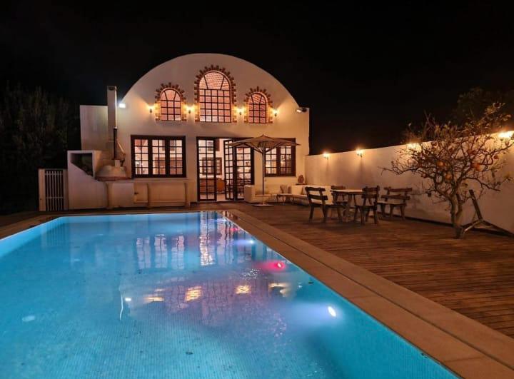 Sunlit arched courtyard of a Tunisian retreat villa at golden hour