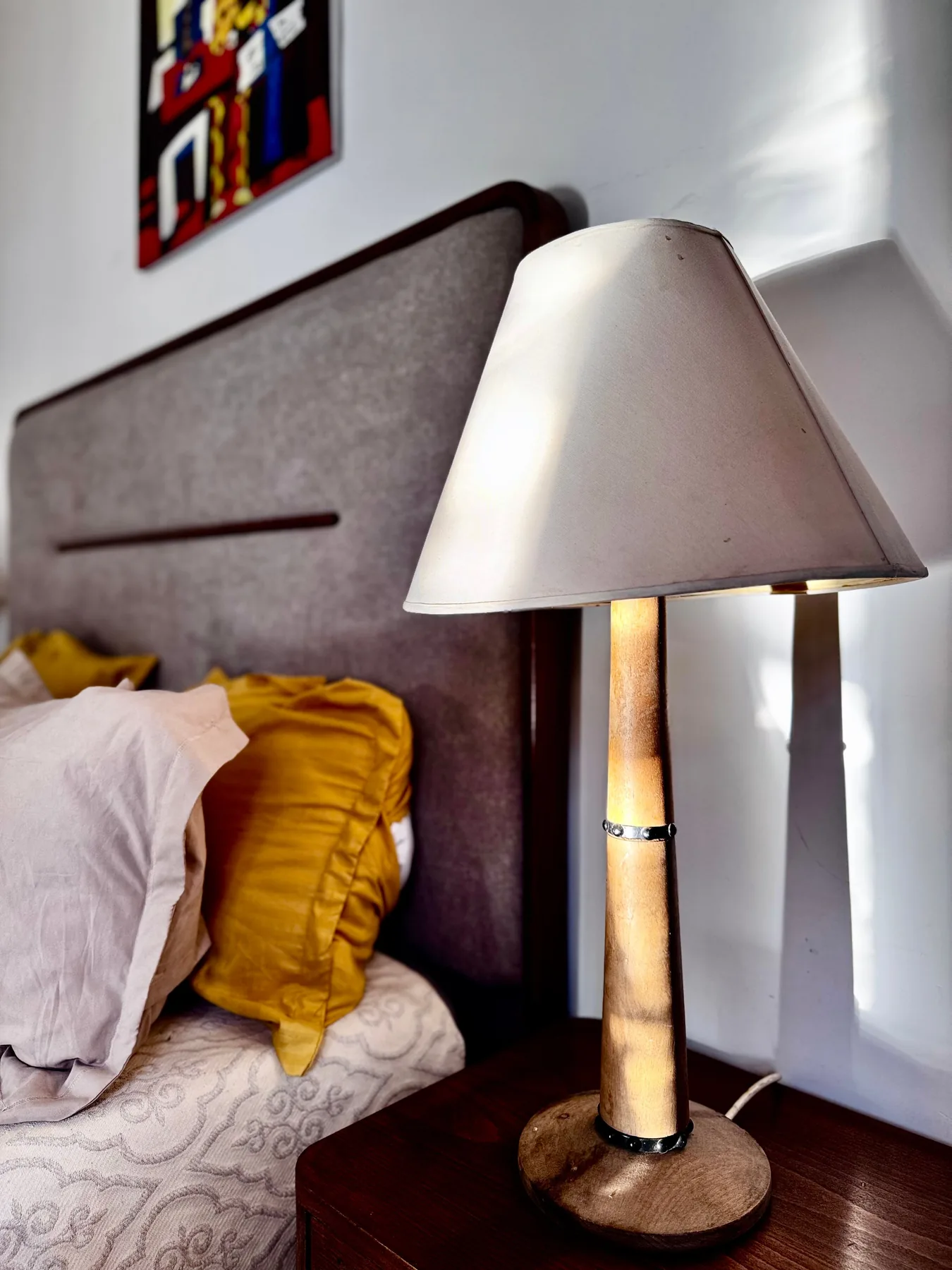 Bedside lamp and cushions in a private room at the Trinity Soul retreat property